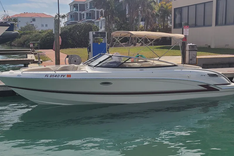 The Image of 2015 Formula 270 Bowrider boat docked in a marina with clear water. - 0