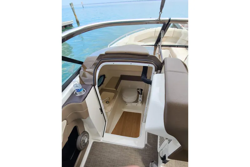 Slide: The Image of 2015 Formula 270 Bowrider boat interior with open cabin door and visible toilet. - 11