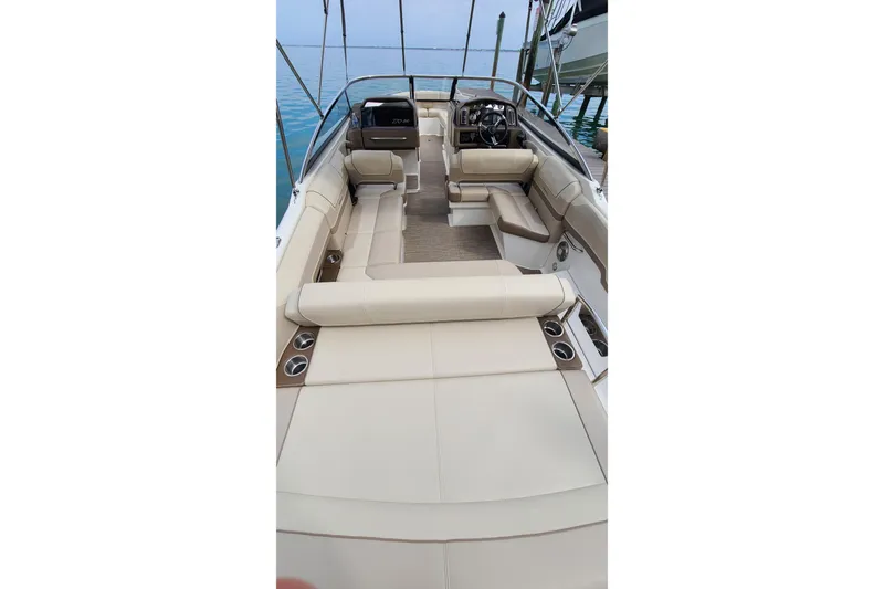 Slide: The Image of 2015 Formula 270 Bowrider interior with beige seating and sleek design. - 23