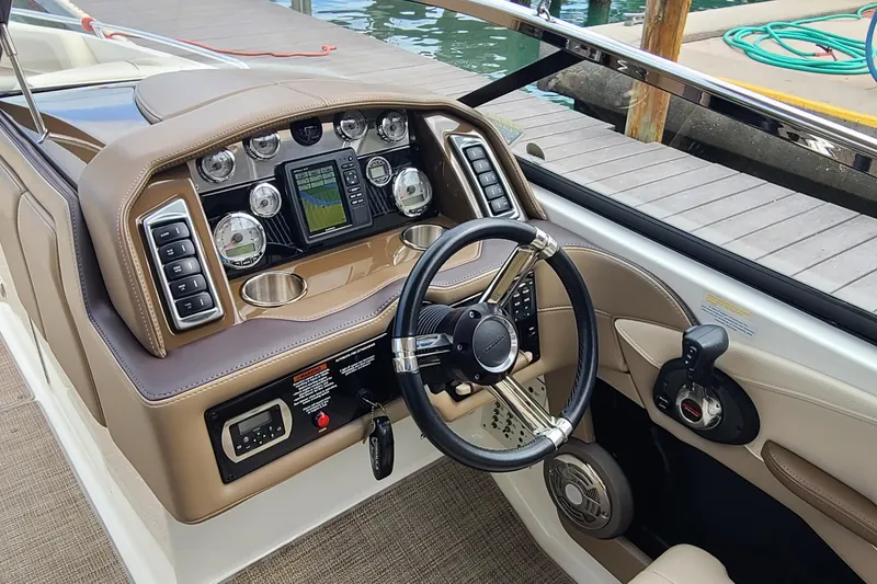 Slide: The Image of 2015 Formula 270 Bowrider dashboard with steering wheel and control panel. - 6