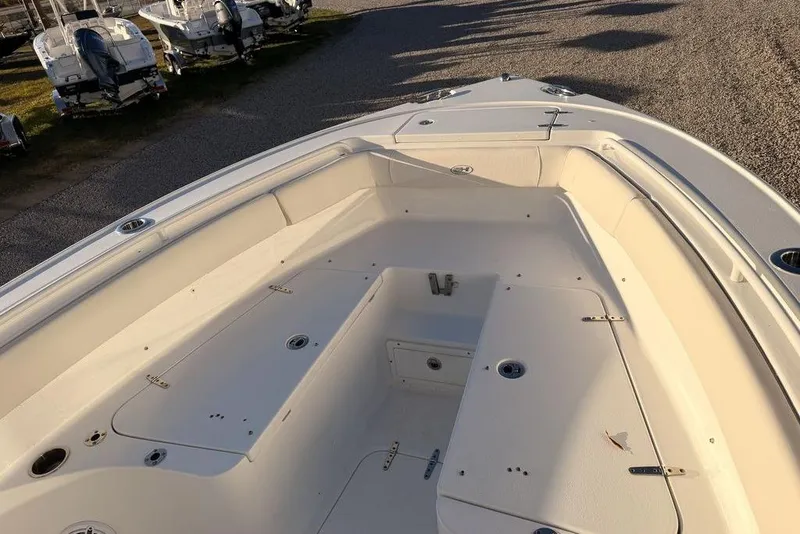 Slide: The Image of 2025 Sea Hunt Ultra 255 SE boat interior with spacious seating and storage compartments. - 5