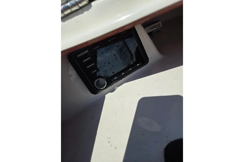 Slide: The Image of Kicker audio system on 2020 Starcraft Limited Runabout 172 OB Sport boat dashboard. - 10