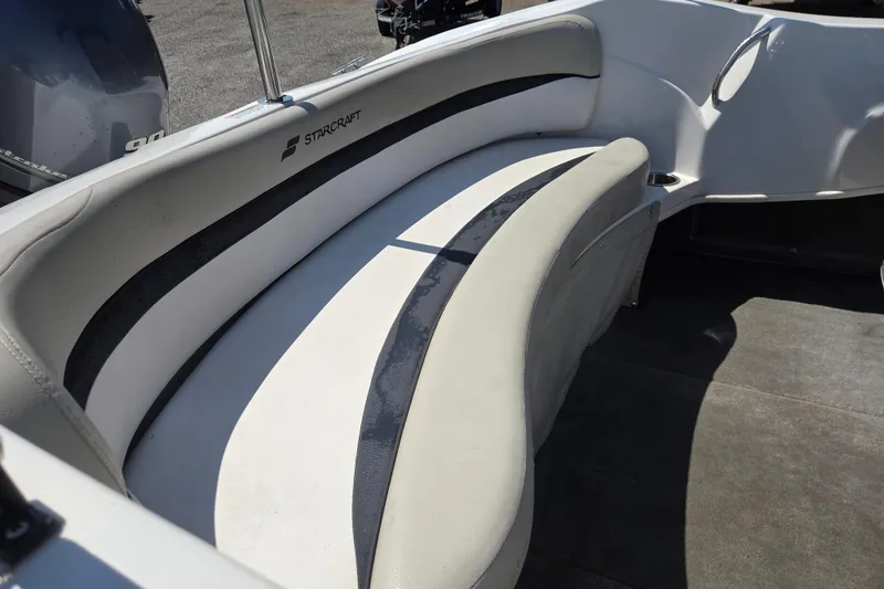 Slide: The Image of 2020 Starcraft Limited Runabout 172 OB Sport boat interior with curved seating. - 12