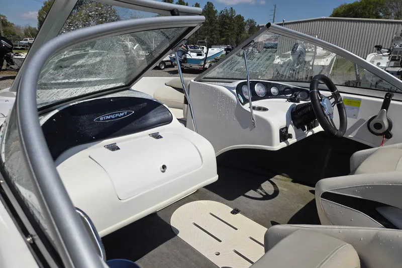 Slide: The Image of 2020 Starcraft Limited Runabout 172 OB Sport boat interior with steering wheel and seating. - 14