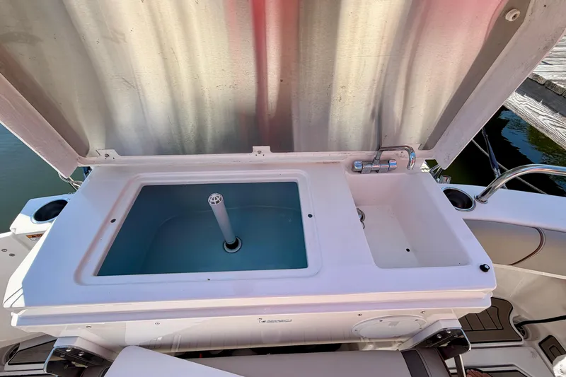 Slide: The Image of Livewell and sink on 2022 Cutwater C-32 CB boat, open lid view. - 18