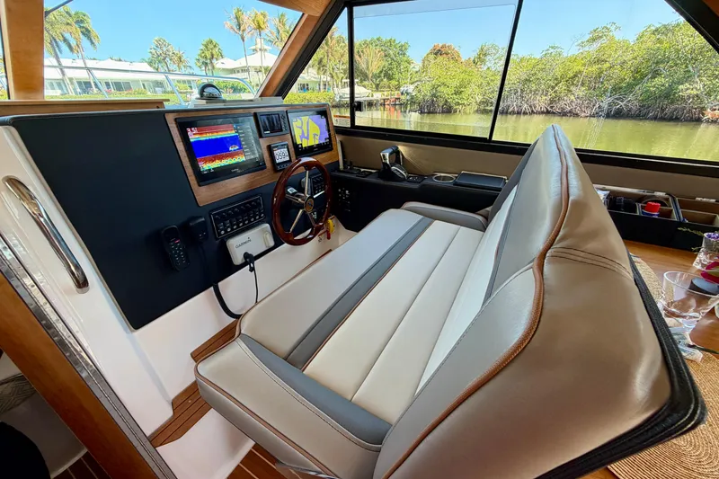 Slide: The Image of 2022 Cutwater C-32 CB helm with modern navigation displays and comfortable seating. - 36