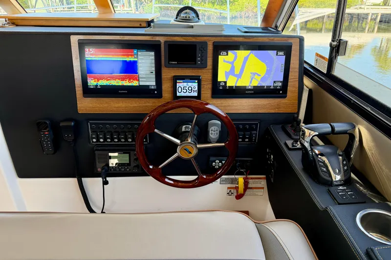 Slide: The Image of Helm of 2022 Cutwater C-32 CB with advanced navigation and control systems. - 39