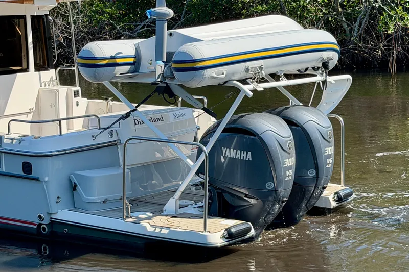 Slide: The Image of 2022 Cutwater C-32 CB with Yamaha outboard engines and inflatable boat on davit system. - 4