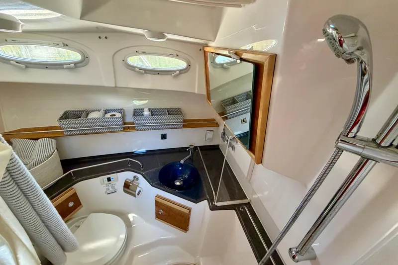 Slide: The Image of Luxurious bathroom in 2022 Cutwater C-32 CB boat with modern fixtures and storage. - 43