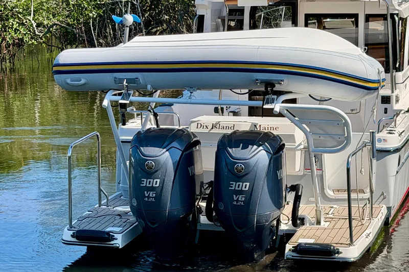 Slide: The Image of 2022 Cutwater C-32 CB boat with dual Yamaha 300 V6 engines and inflatable dinghy. - 5