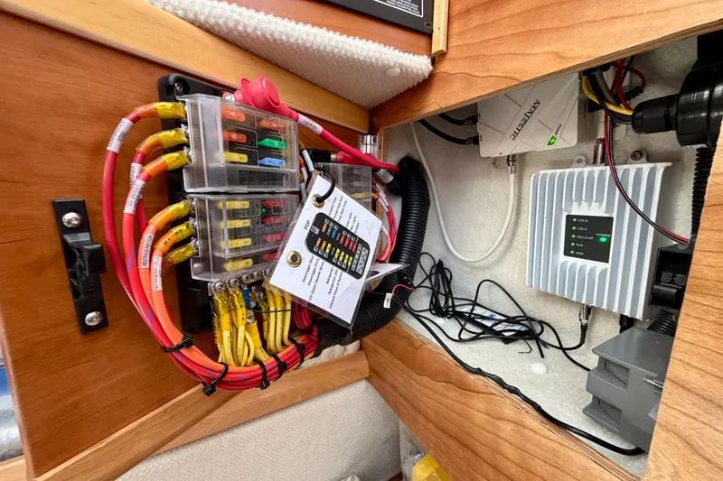 Slide: The Image of Electrical panel inside 2022 Cutwater C-32 CB boat, showcasing wiring and components. - 50