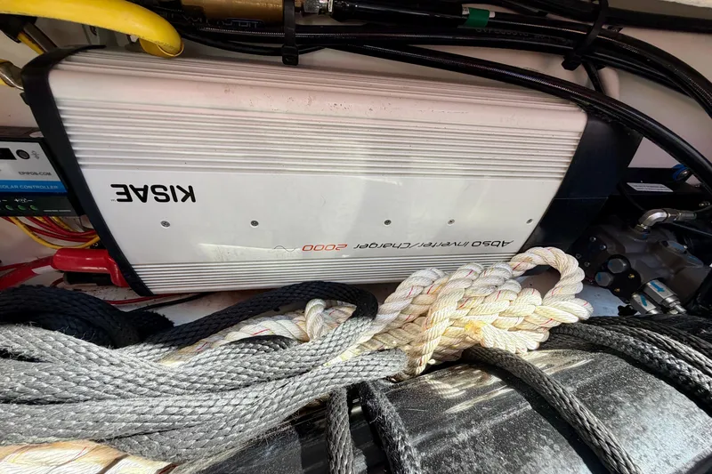 Slide: The Image of Cutwater C-32 CB 2022 boat equipment with Kisae inverter and ropes in storage compartment. - 52