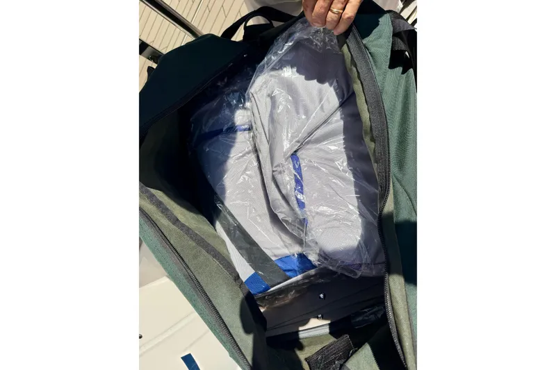 Slide: The Image of Open bag revealing packaged items on a 2022 Cutwater C-32 CB boat. - 53