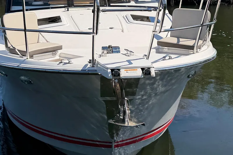 Slide: The Image of 2022 Cutwater C-32 CB boat bow with seating and anchor in water. - 8