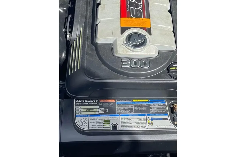 Slide: The Image of Engine cover of a 2017 Chaparral 257 SSX with Mercury maintenance schedule. - 11