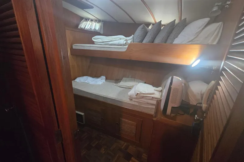Slide: The Image of Cozy cabin interior of 1982 Ocean Alexander 50 Mark I yacht with bunk beds. - 12