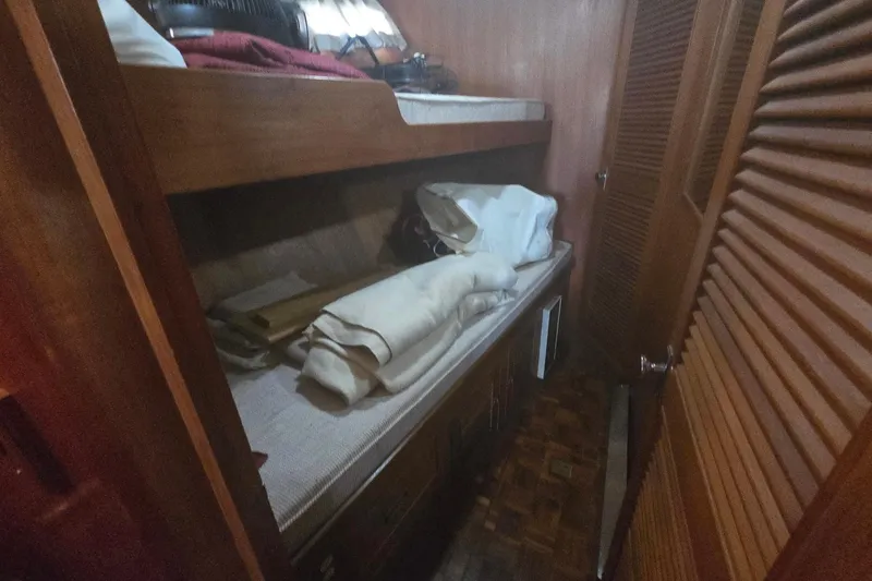 Slide: The Image of Interior cabin of 1982 Ocean Alexander 50 Mark I yacht with wooden bunk beds. - 13
