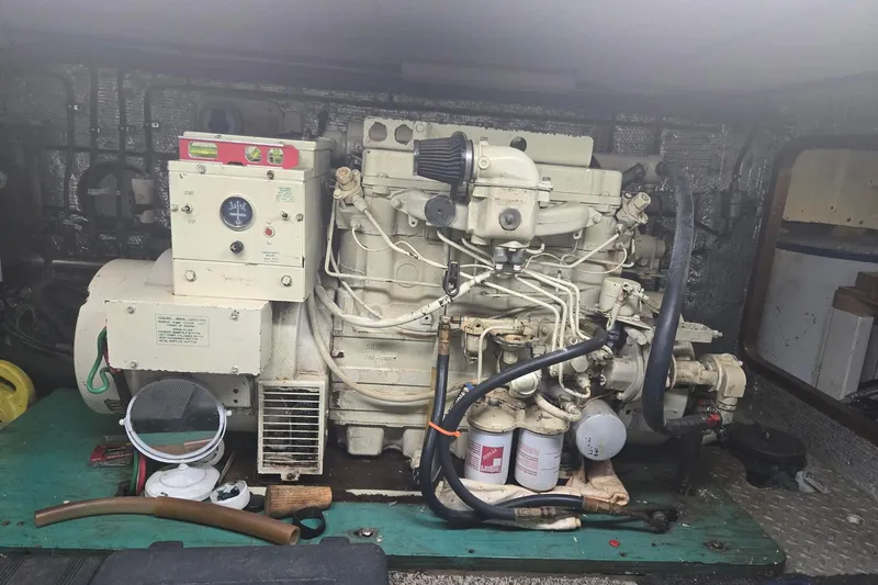 Slide: The Image of Engine room of 1982 Ocean Alexander 50 Mark I yacht, featuring a generator system. - 19