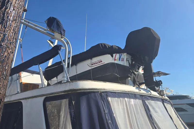 Slide: The Image of 1982 Ocean Alexander 50 Mark I yacht with covered equipment on deck under clear blue sky. - 21