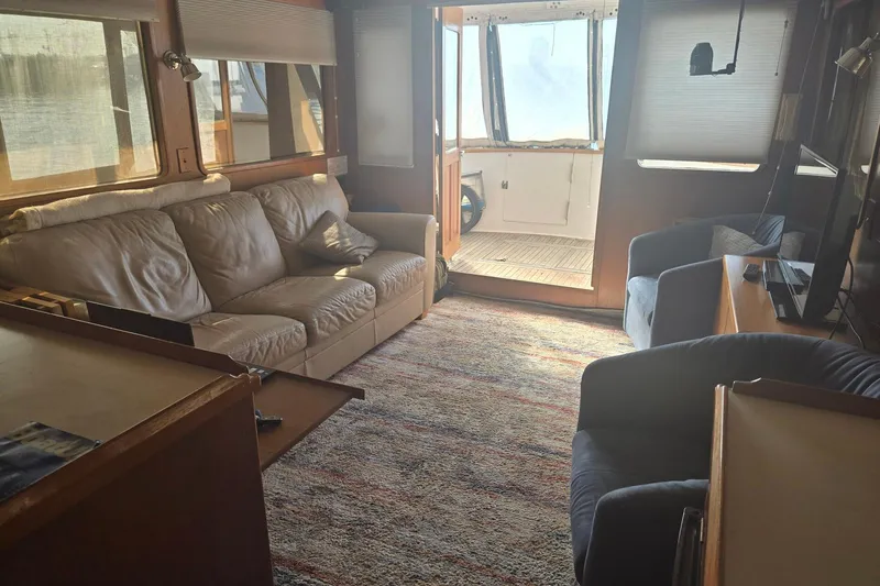 Slide: The Image of Interior of 1982 Ocean Alexander 50 Mark I yacht with cozy seating and natural light. - 8