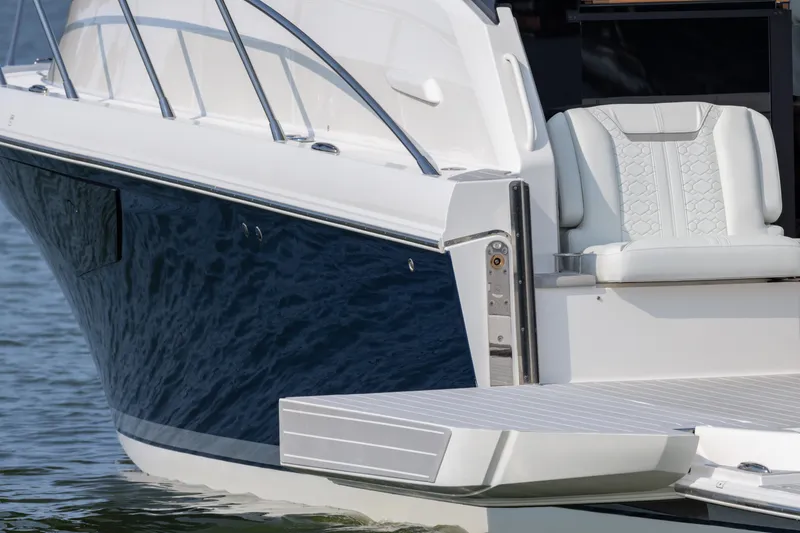 Slide: The Image of 2025 Tiara Yachts 43 LE luxury boat with sleek design and comfortable seating. - 12