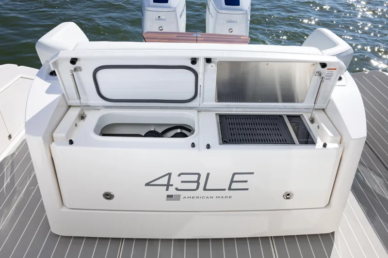 Slide: The Image of 2025 Tiara Yachts 43 LE boat deck with open storage compartments. - 17