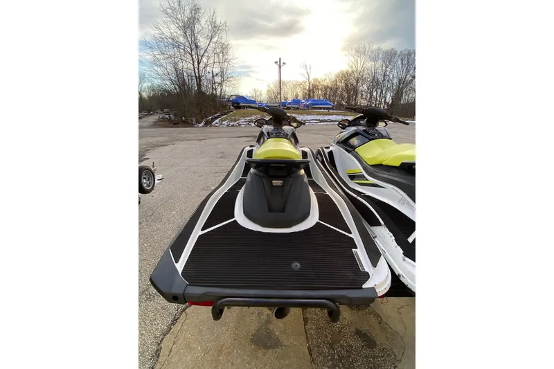 Slide: The Image of 2021 Yamaha WaveRunner VX-C jet skis parked outdoors on a cloudy day. - 9