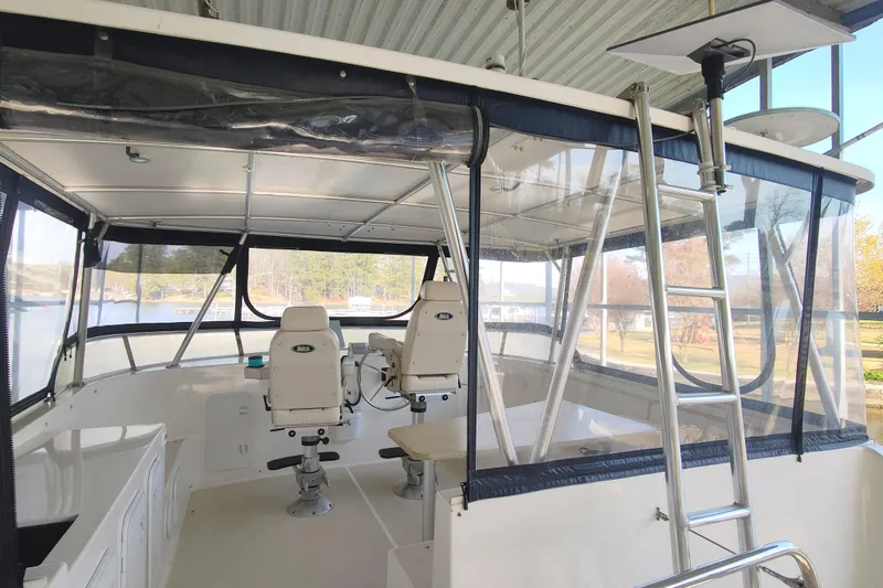 Slide: The Image of Interior of 2009 Maine Cat P-47 boat with helm chairs and panoramic windows. - 18