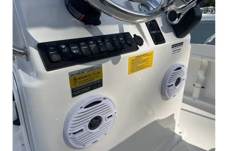 Slide: The Image of 2026 Key West 1720 Center Console dashboard with controls and speakers. - 13