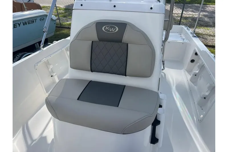 Slide: The Image of 2026 Key West 1720 Center Console boat seat with gray and white upholstery. - 14