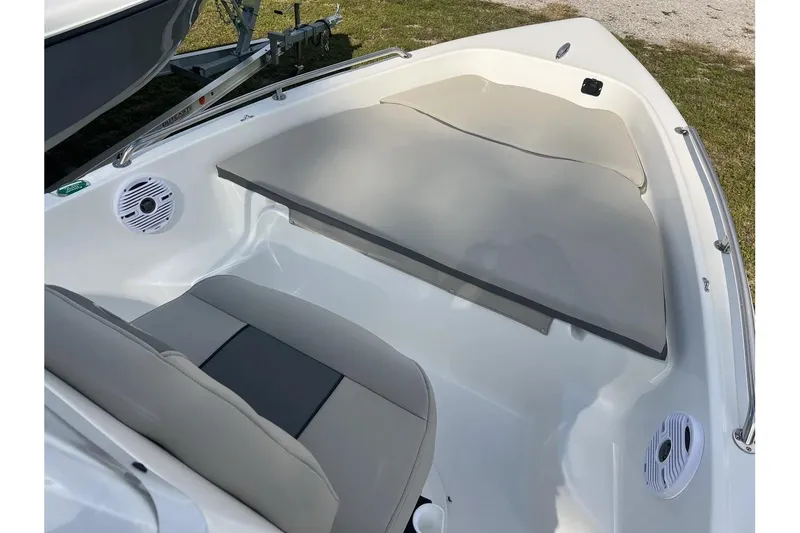 Slide: The Image of 2026 Key West 1720 Center Console boat interior with seating and speakers. - 16