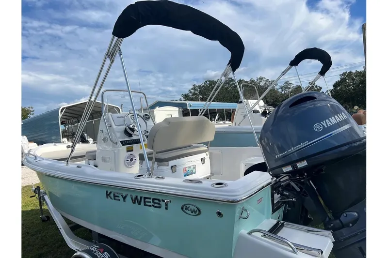 Slide: The Image of 2026 Key West 1720 Center Console boat with Yamaha engine, parked outdoors. - 3