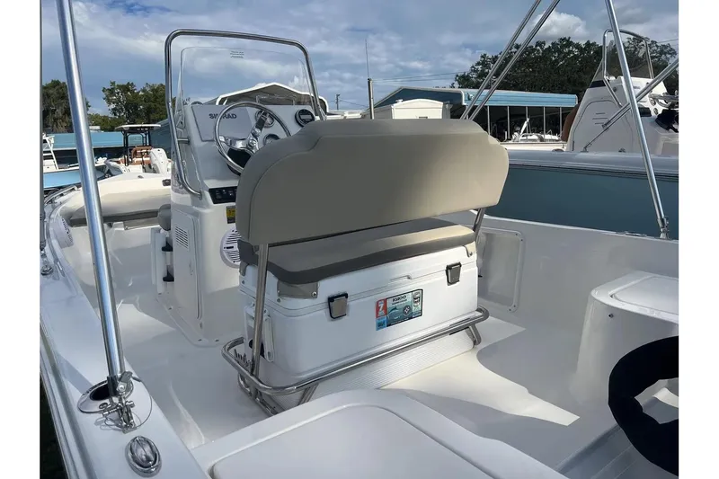 Slide: The Image of 2026 Key West 1720 Center Console boat interior with steering wheel and seating. - 8