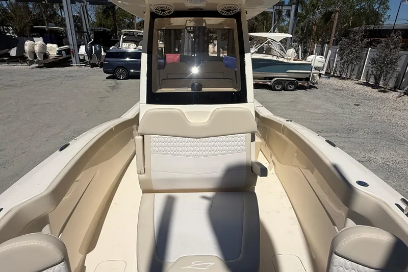 Slide: The Image of 2026 Scout 260 LXF boat interior with beige seating and modern design. - 16