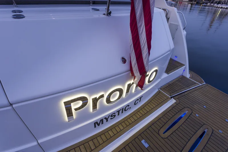 Slide: The Image of Riviera 5000 Sport Yacht 2016, docked with American flag, Mystic, CT. - 11