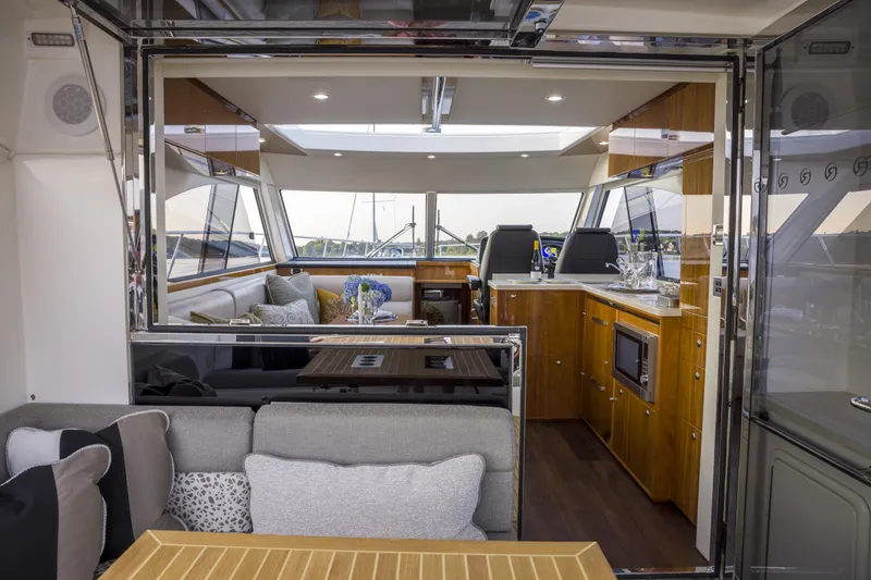 Slide: The Image of Luxurious interior of 2016 Riviera 5000 Sport Yacht with modern furnishings and sleek design. - 16