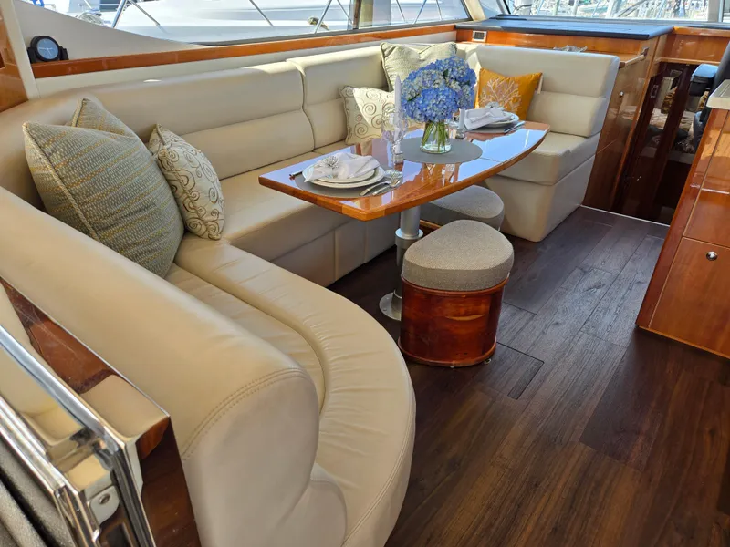 Slide: The Image of Luxurious interior of 2016 Riviera 5000 Sport Yacht with elegant seating and dining area. - 19
