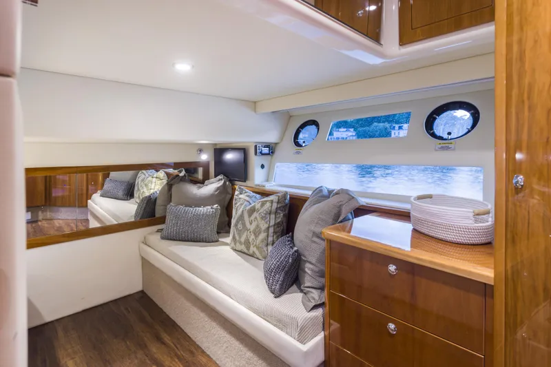 Slide: The Image of Luxurious interior of 2016 Riviera 5000 Sport Yacht with elegant seating and wooden cabinetry. - 29