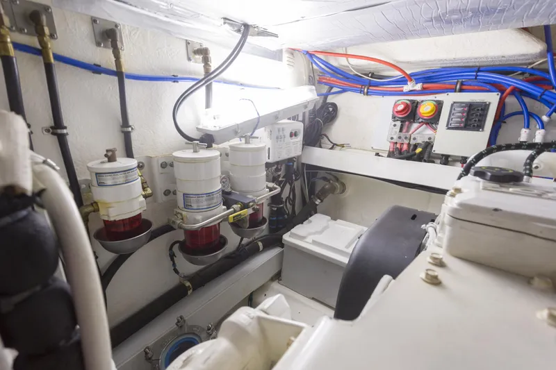 Slide: The Image of Engine room of 2016 Riviera 5000 Sport Yacht with fuel filters and wiring. - 35