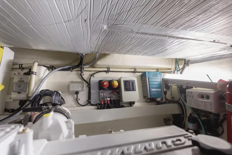 Slide: The Image of Engine room of 2016 Riviera 5000 Sport Yacht with electrical panels and wiring. - 36