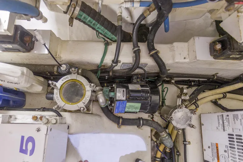 Slide: The Image of Engine room of 2016 Riviera 5000 Sport Yacht, showcasing mechanical components and wiring. - 37