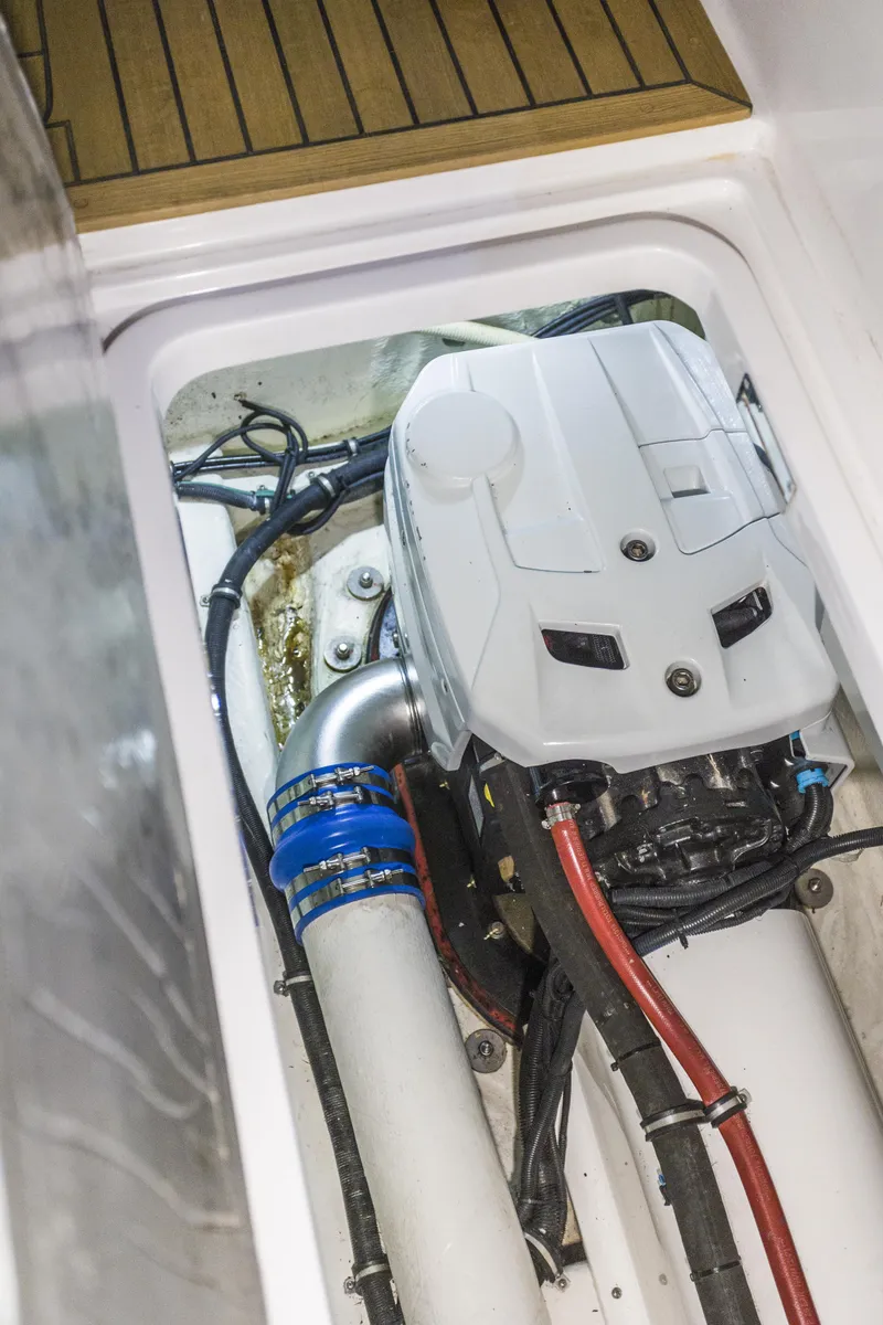 Slide: The Image of Engine compartment of 2016 Riviera 5000 Sport Yacht, showcasing mechanical components and wiring. - 39