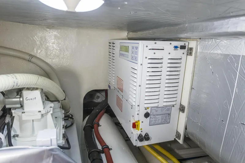 Slide: The Image of Engine room of 2016 Riviera 5000 Sport Yacht with electrical components and wiring. - 41