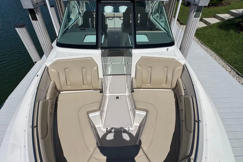 Slide: The Image of 2016 Pursuit DC 325 Dual Console boat with spacious seating and sleek design. - 30