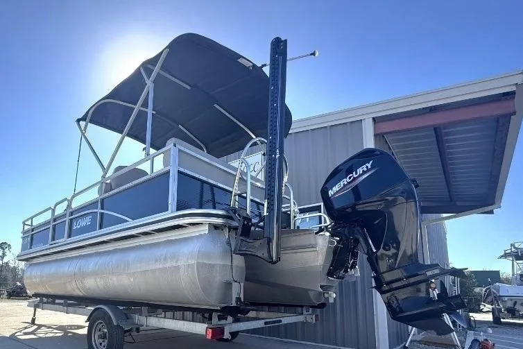 Slide: The Image of 2022 Lowe Ultra 182 Fish & Cruise pontoon boat with Mercury outboard motor on trailer. - 4