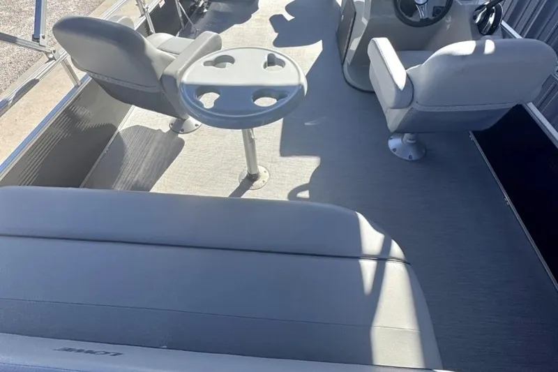 Slide: The Image of 2022 Lowe Ultra 182 Fish & Cruise boat interior with seating and table. - 9