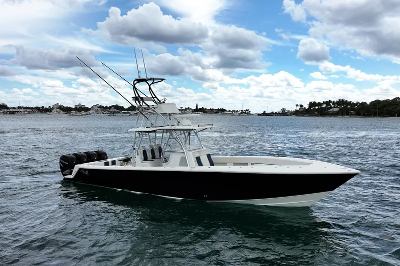 The Image of 2022 SeaVee 390Z boat on water with clear sky and clouds. - 0