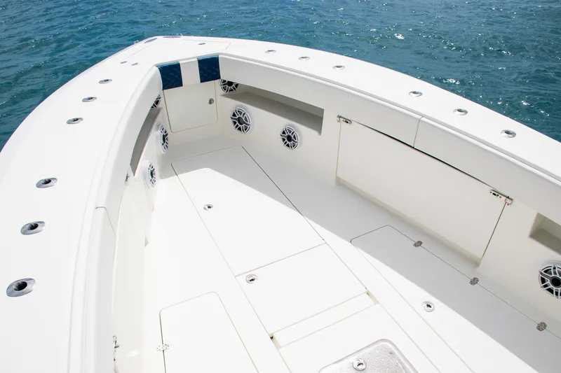 Slide: The Image of 2022 SeaVee 390Z boat deck with storage compartments and ocean view. - 10