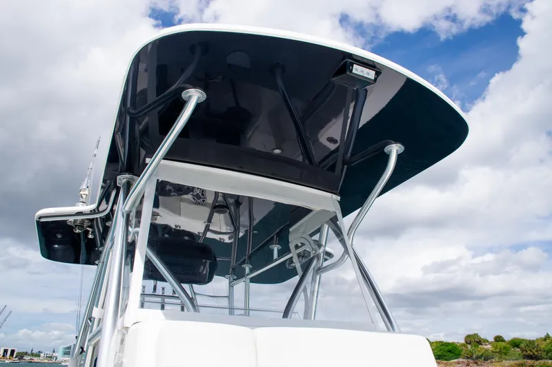 Slide: The Image of 2022 SeaVee 390Z boat with sleek T-top design against cloudy sky. - 16