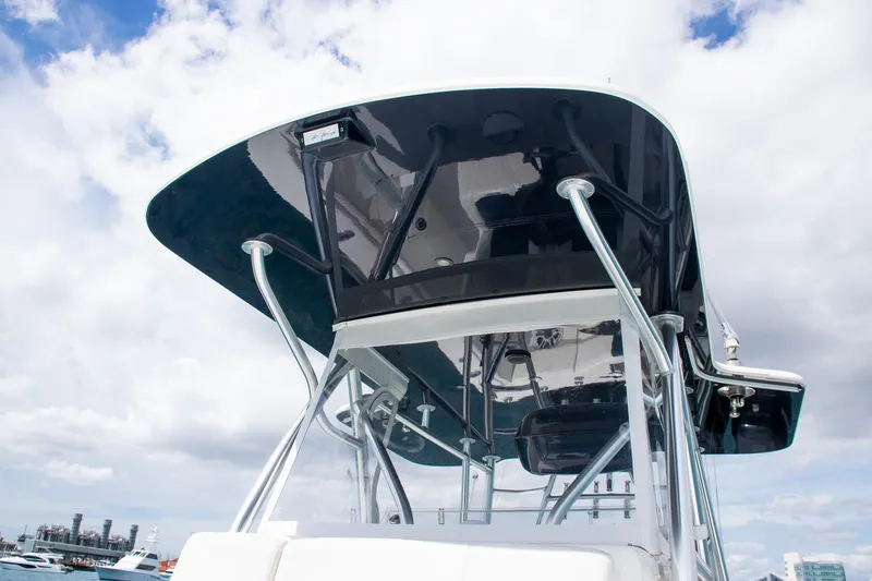 Slide: The Image of 2022 SeaVee 390Z boat with sleek T-top against cloudy sky. - 17